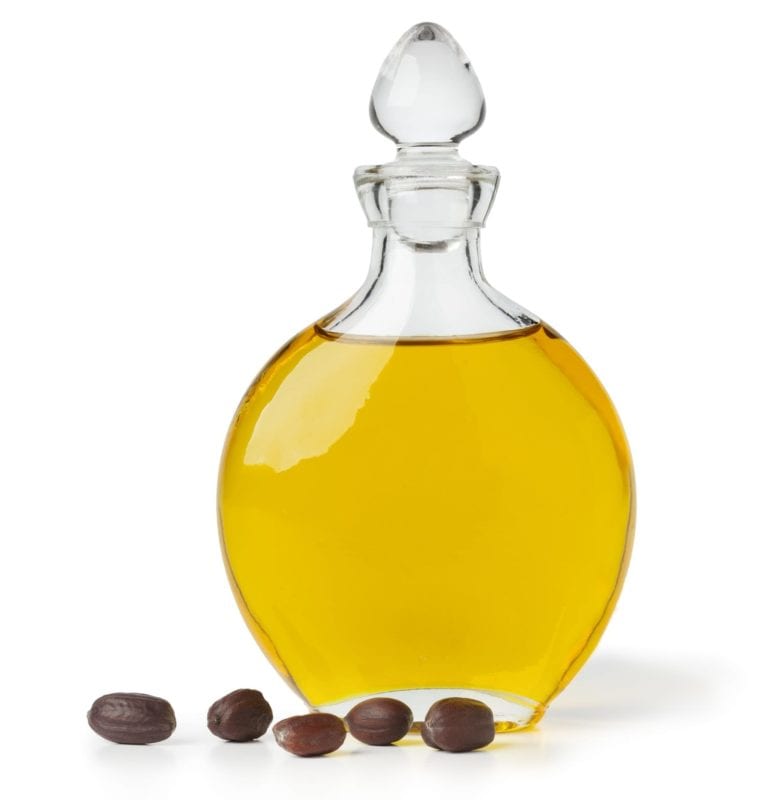 Botle of Jojoba oil and seeds